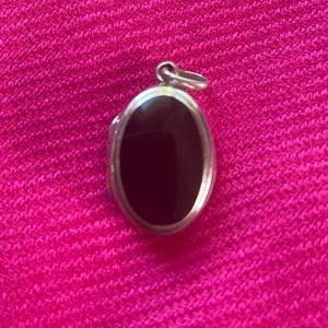 Black onyx and silver locket pendant.